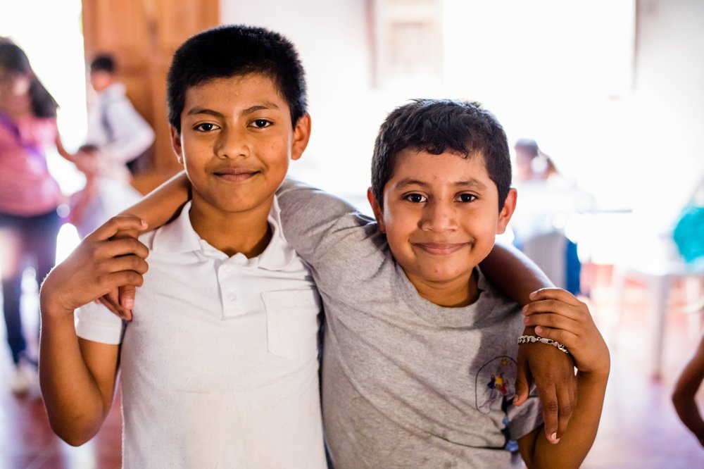 two boys who walked far to eat at ORPHANetwork feeding center