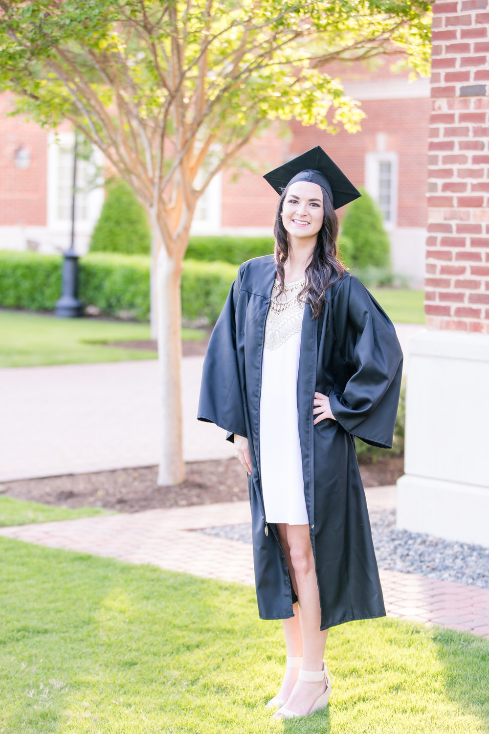 girl with cap and gown for senior portraits at CNU