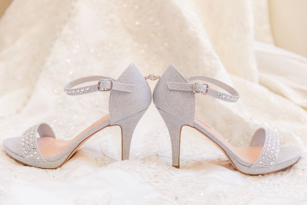 wedding shoes on white dress background