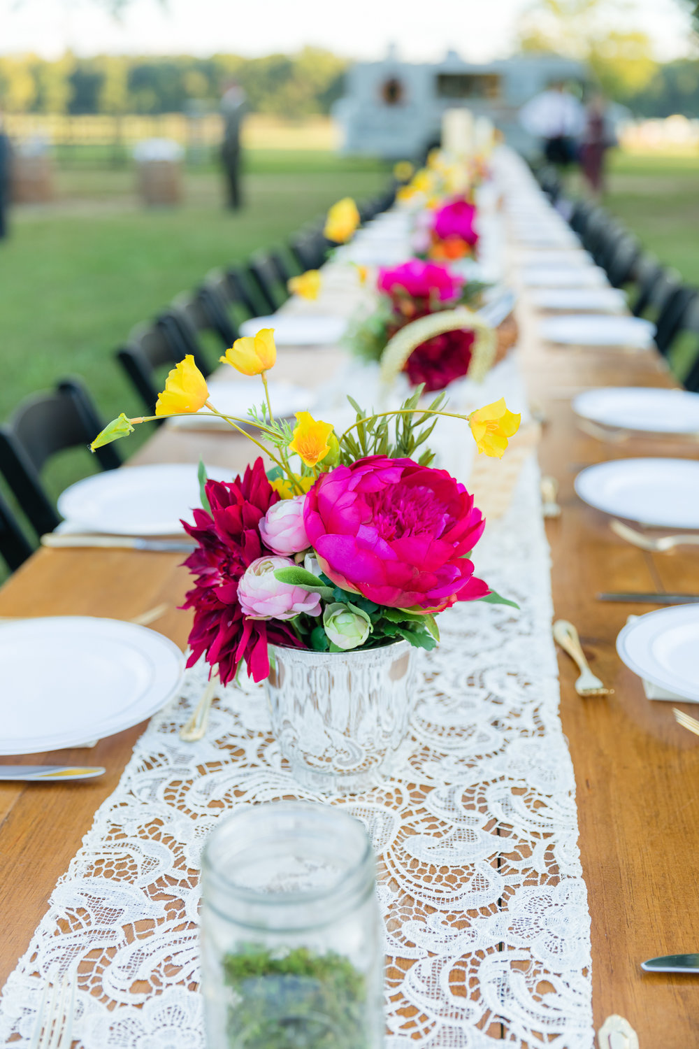 pink and yellow centerpieces for Carlton Farms wedding reception