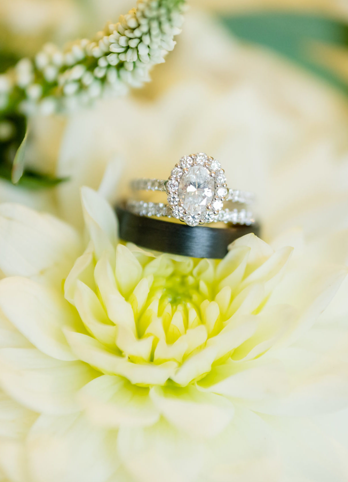 Zoomed in ring photo in flowers at Cedar Point Club Wedding