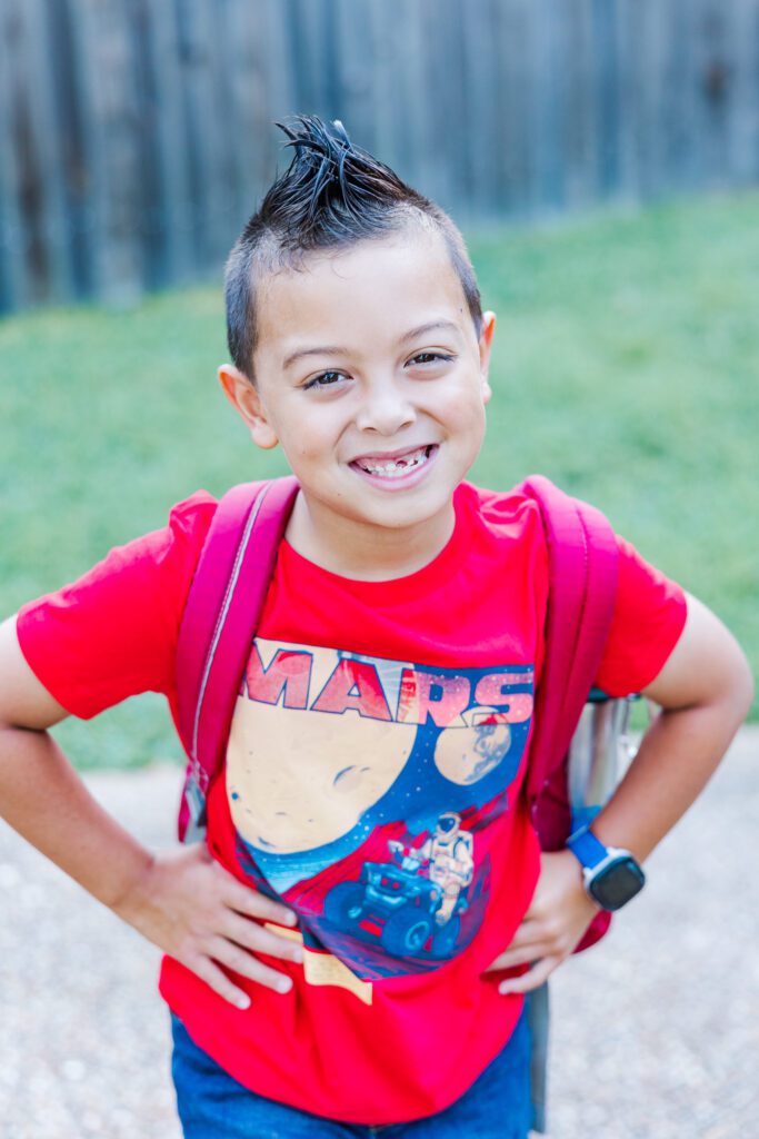 boy with mohawk excited for back to school pictures