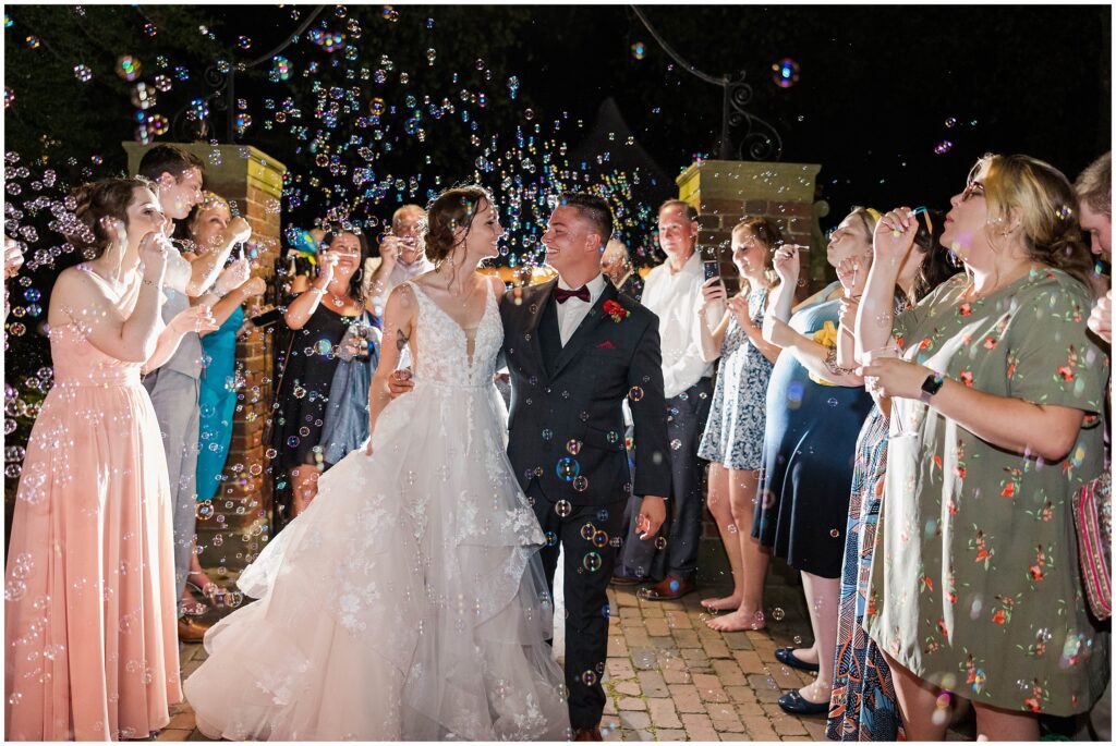 bubble exit with lots of smiles after Williamsburg Inn wedding