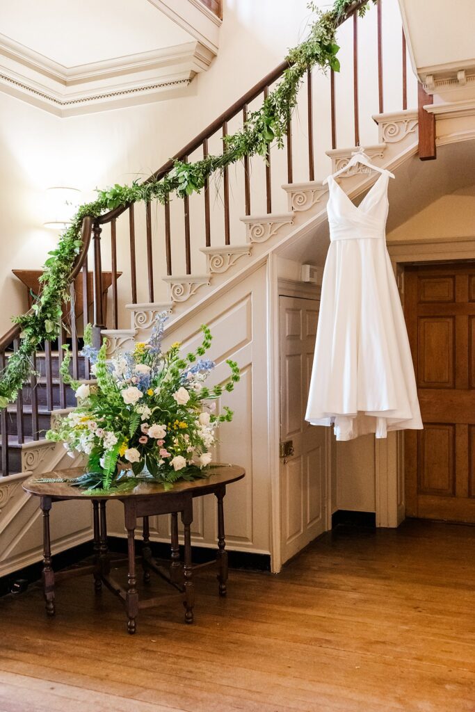 wedding dress hanging in Fairfield Estate staircase for Richmond, VA wedding