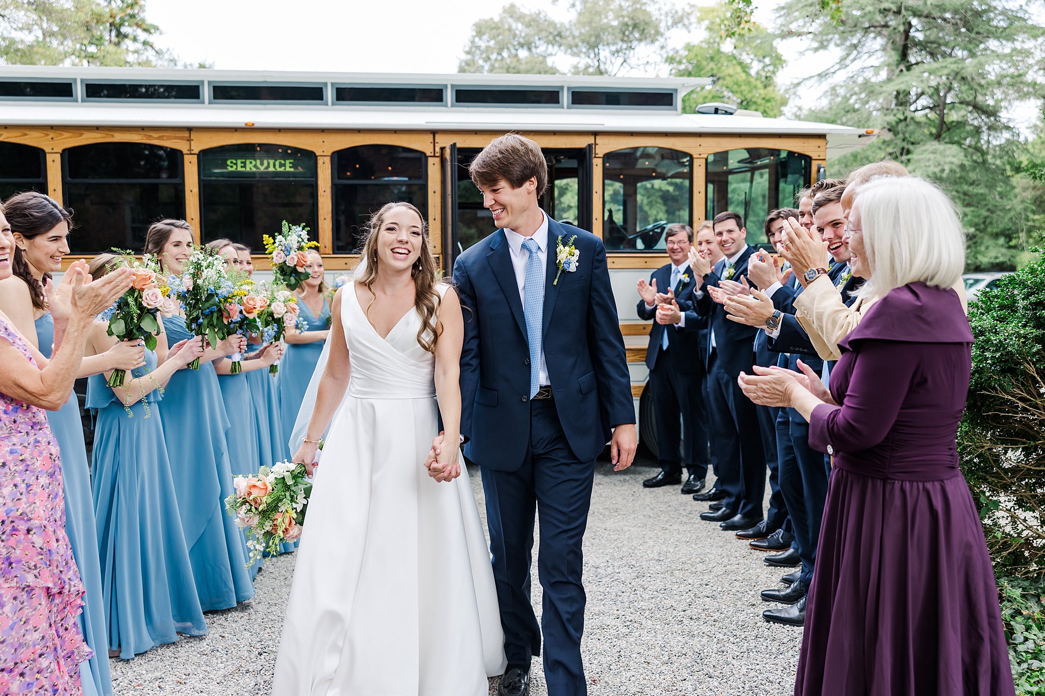 Couple celebrating with RVA Trolley with image by Richmond VA wedding photographer