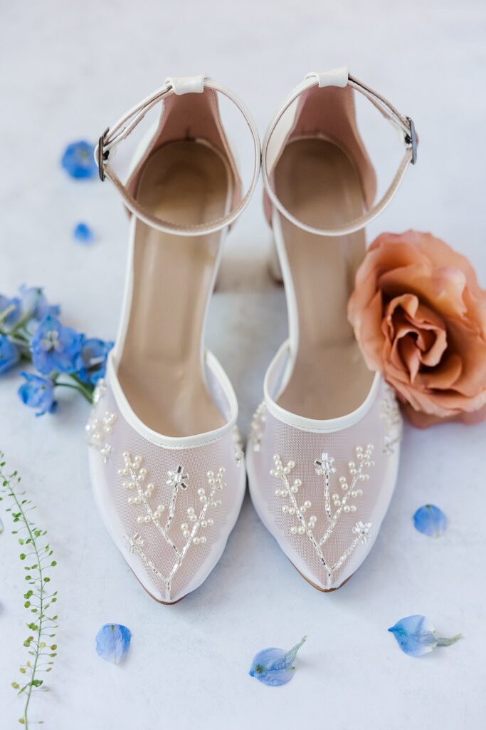 white pearl shoes with blue and pink florals