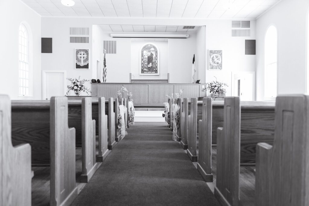 serene black and white image of sanctuary before wedding ceremony
