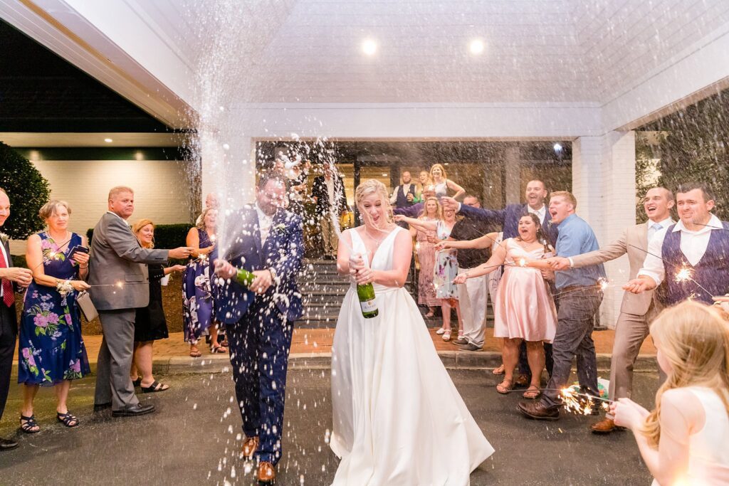 champagne spraying wedding exit idea