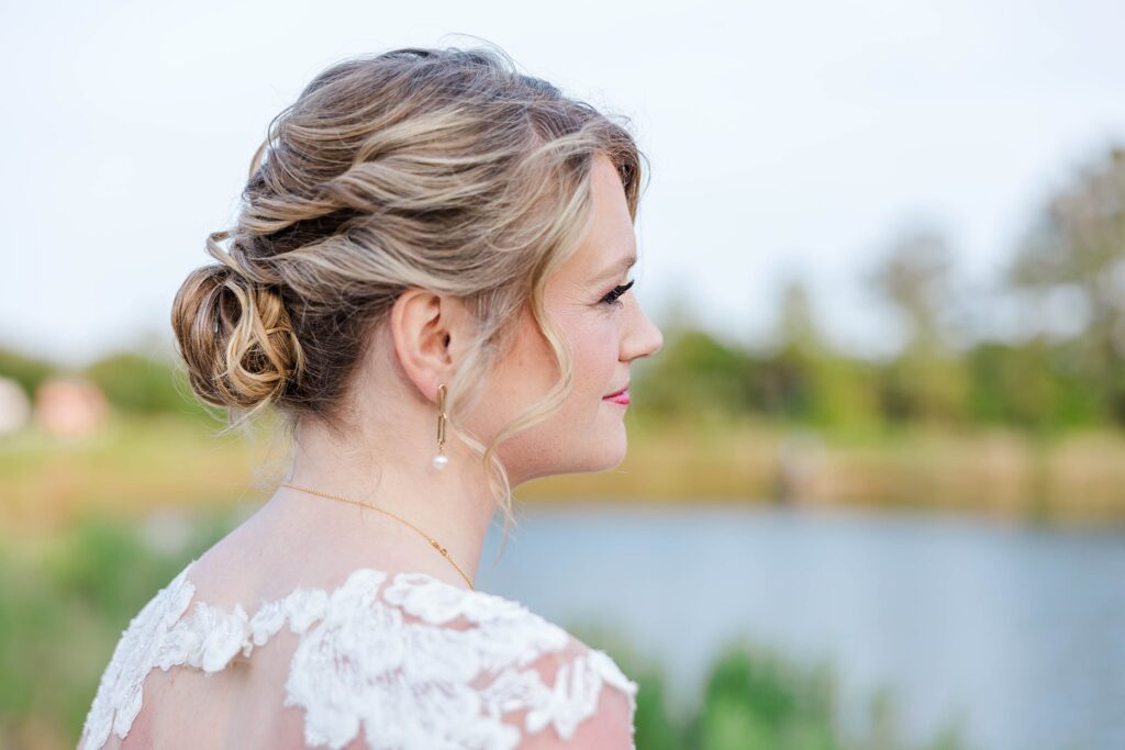 bride gazes out at water