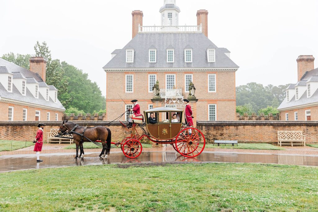 a carriage ride in Colonial Williamsburg on Katie and Trystan's rainy wedding day