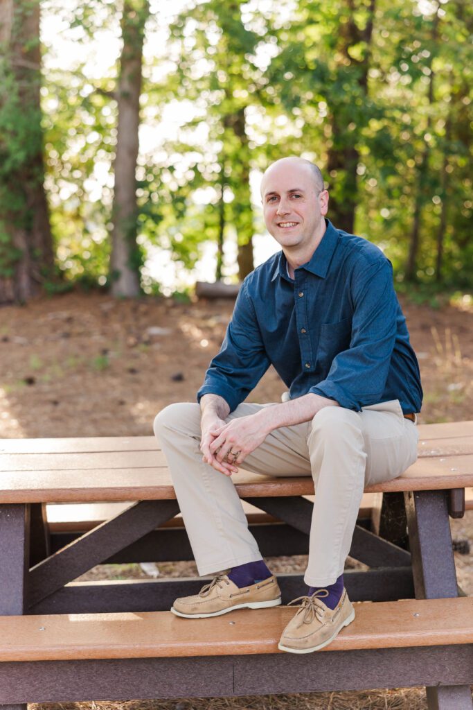 headshot of father on picnic table for family photos at Chickahominy