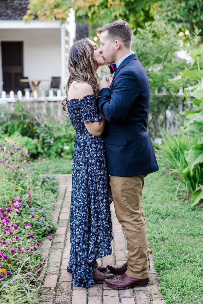 couple kisses during engagement session in Colonial Williamsburg