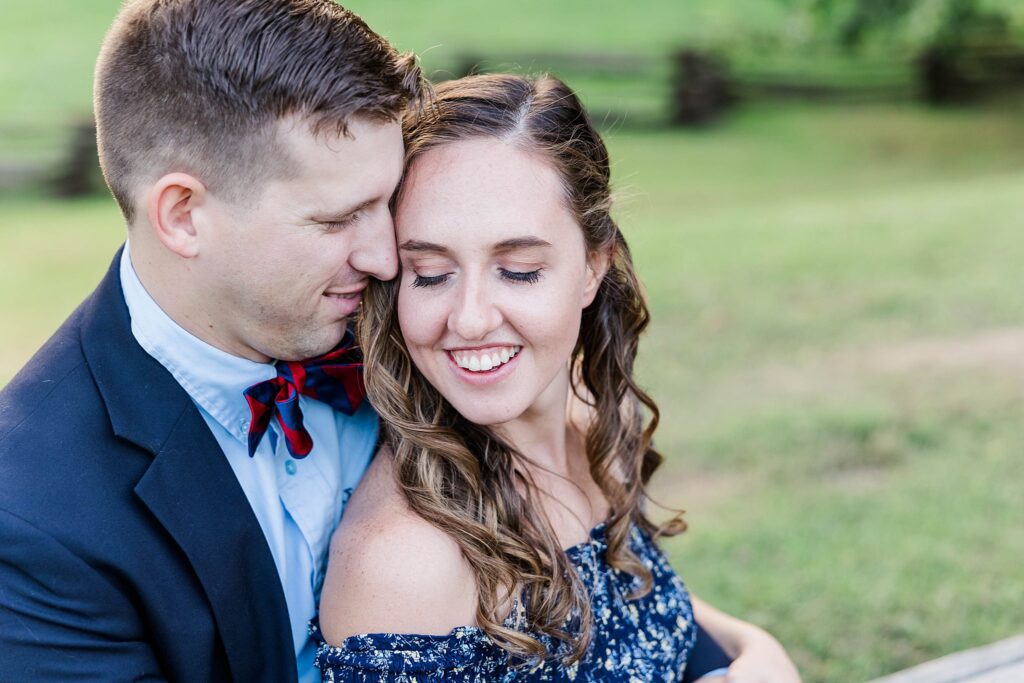Tyler nuzzles Emily for image at fall engagement session