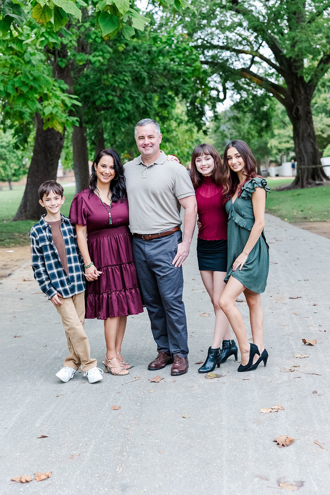 family poses for a portrait near the Governor's Palace for fall family photos in Williamsburg 