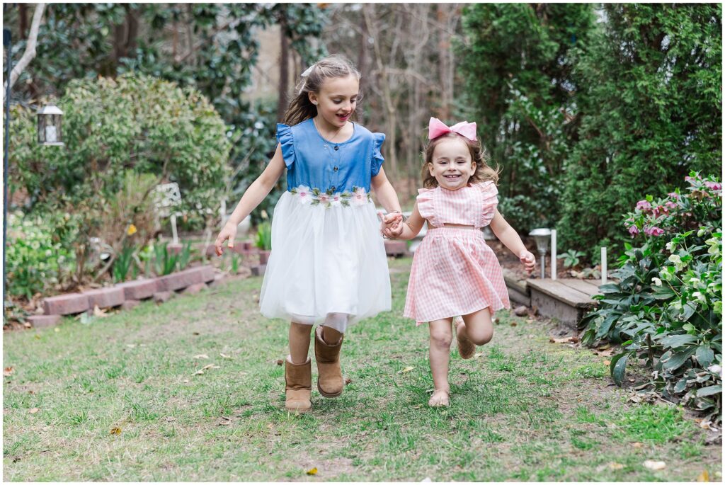sisters run in spring family photo dresses in Williamsburg, VA