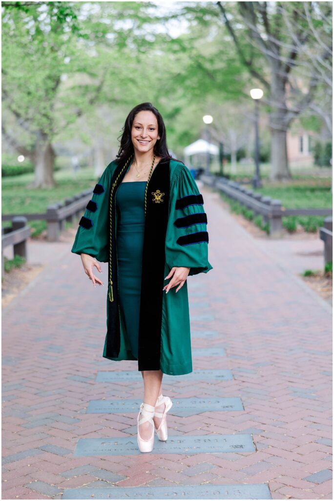 ballet pose with graduation gown for William and Mary college senior photos Williamsburg, VA
