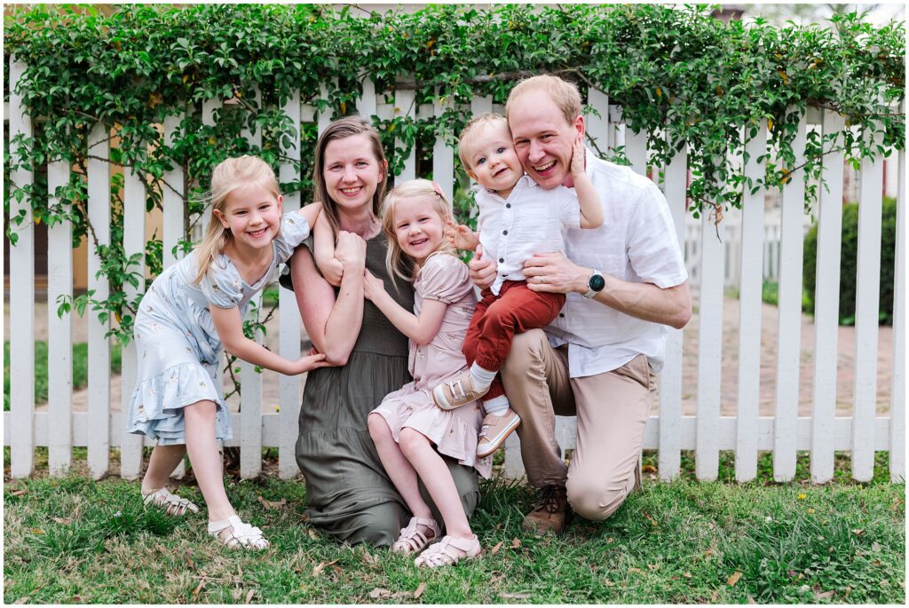 family tickling and laughing for their spring family photos in Williamsburg, VA
